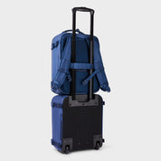 FRENKY Underseater Backpack in Blue on the handle of the FRENKY Underseat Trolley in Blue