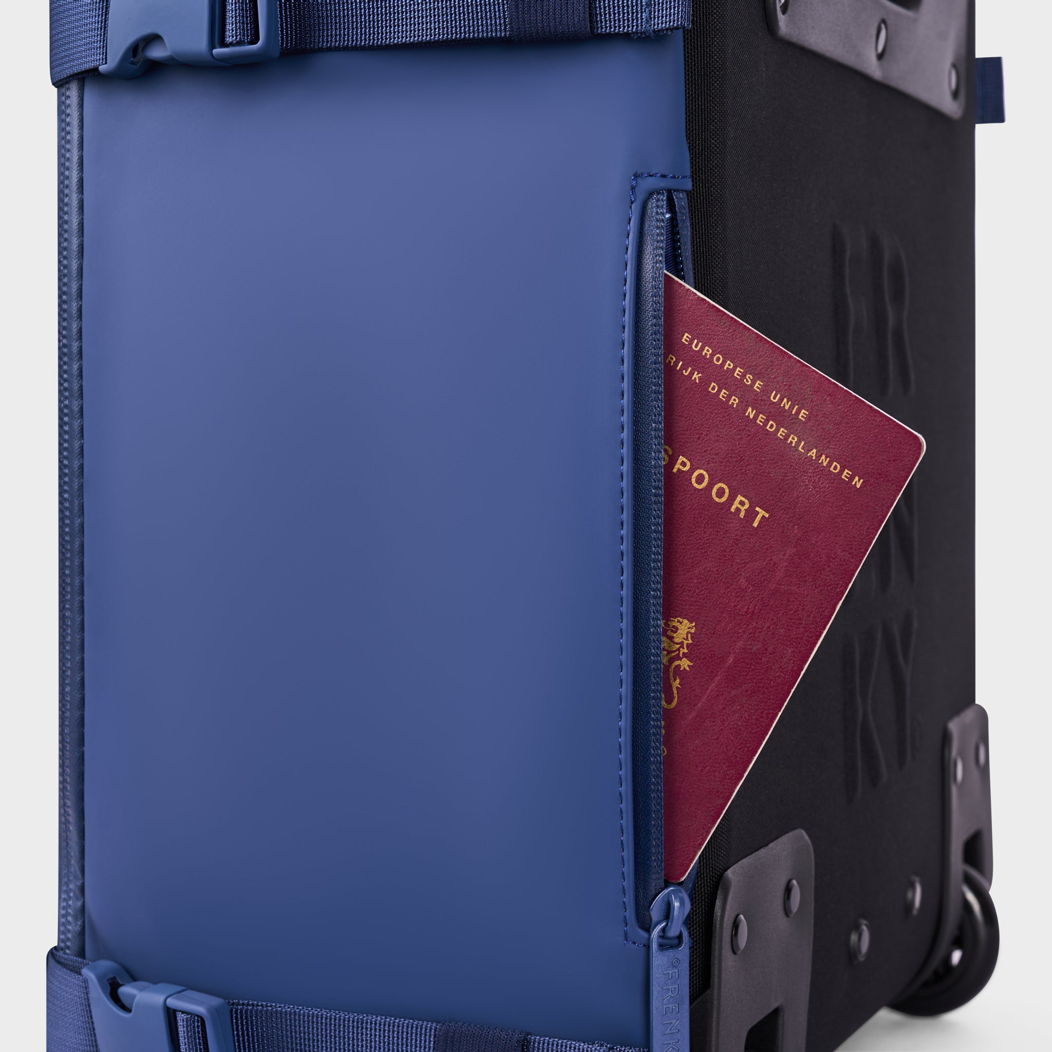 Passport in the hidden passport pocket of the FRENKY Underseat Trolley in Blue